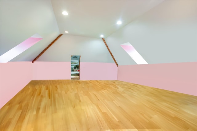 226 Windsor Rd, Fishkill, NY 12524 - additional living space featuring recessed lighting, wood finished floors, vaulted ceiling, and a skylight