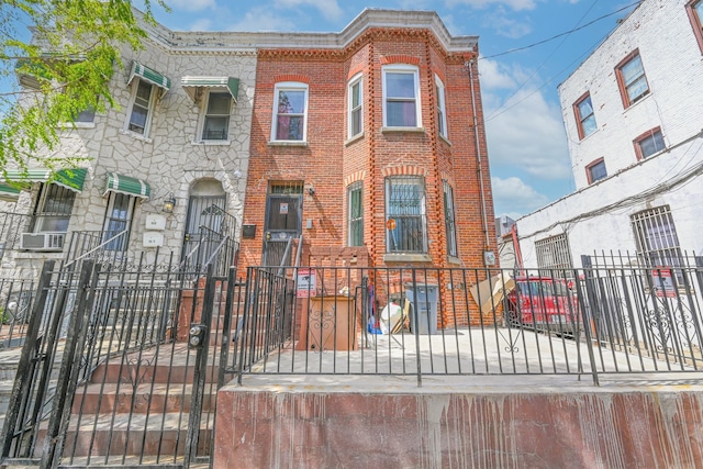 262 E 39th St, Brooklyn, NY 11203 - multi unit property with brick siding, a fenced front yard, a gate, and cooling unit
