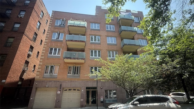 8510 Elmhurst Ave Unit 6B, Elmhurst, NY 11373 - view of apartment building / complex with a garage
