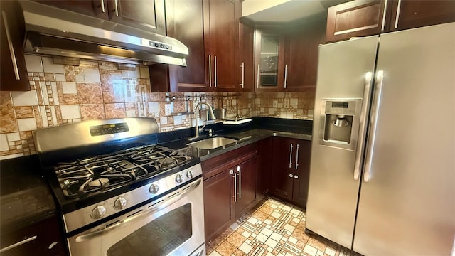 8510 Elmhurst Ave Unit 6B, Elmhurst, NY 11373 - kitchen with stainless steel appliances, under cabinet range hood, a sink, decorative backsplash, and glass insert cabinets