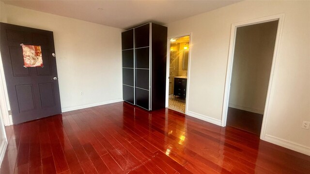 8510 Elmhurst Ave Unit 6B, Elmhurst, NY 11373 - unfurnished bedroom with wood finished floors and baseboards