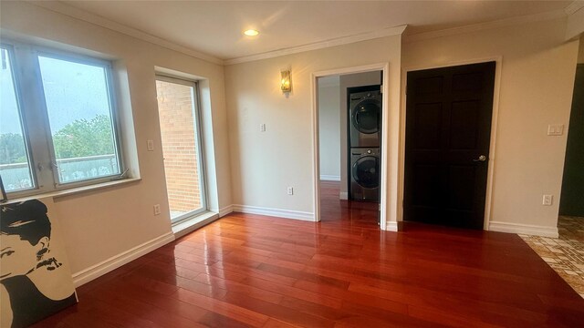 8510 Elmhurst Ave Unit 6B, Elmhurst, NY 11373 - unfurnished room featuring stacked washer / drying machine, hardwood / wood-style flooring, ornamental molding, recessed lighting, and baseboards