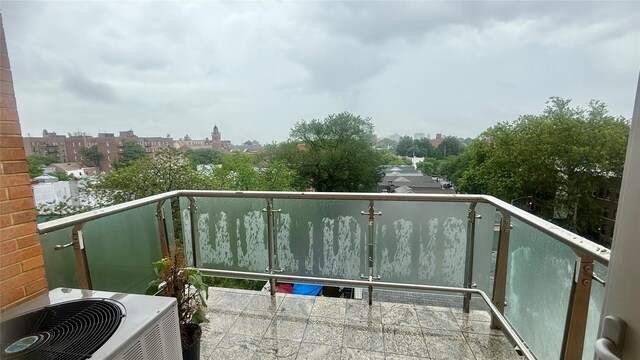8510 Elmhurst Ave Unit 6B, Elmhurst, NY 11373 - balcony featuring cooling unit and a view of city