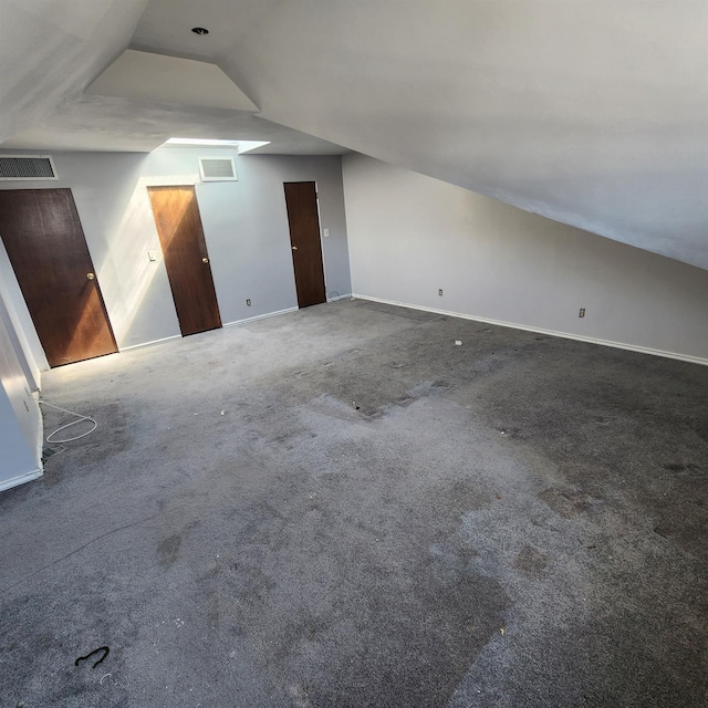 639 E Broadway Unit 5, Long Beach, NY 11561 - additional living space with carpet flooring and vaulted ceiling