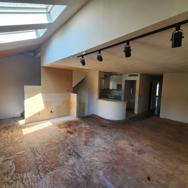 639 E Broadway Unit 5, Long Beach, NY 11561 - unfurnished living room featuring a skylight and rail lighting
