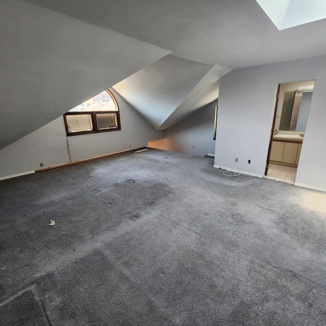 639 E Broadway Unit 5, Long Beach, NY 11561 - bonus room featuring lofted ceiling, carpet flooring, and a skylight