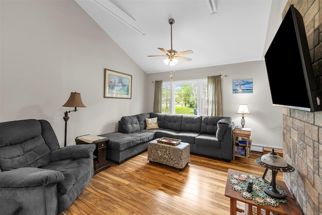 2410 Bruynswick Rd, Wallkill, NY 12589 - living room featuring lofted ceiling, light wood-style flooring, ceiling fan, and a baseboard heating unit
