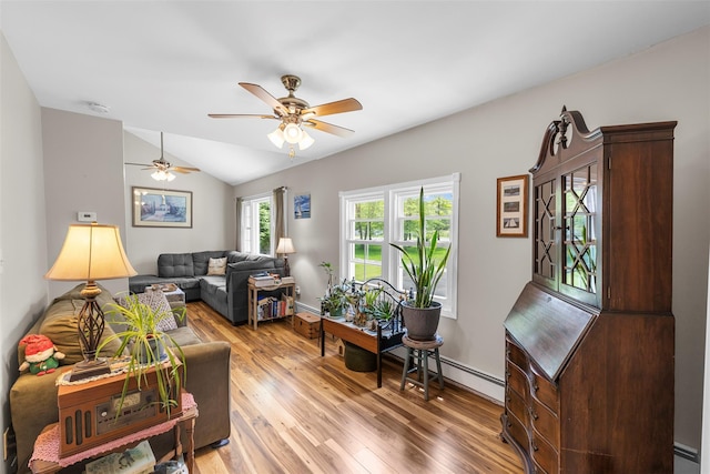 2410 Bruynswick Rd, Wallkill, NY 12589 - living room with light wood-style flooring, vaulted ceiling, ceiling fan, and baseboards