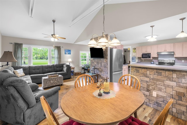 2410 Bruynswick Rd, Wallkill, NY 12589 - dining room with lofted ceiling, light wood-style flooring, and a ceiling fan