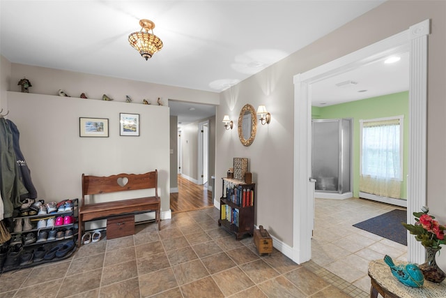 2410 Bruynswick Rd, Wallkill, NY 12589 - corridor featuring a baseboard radiator and baseboards