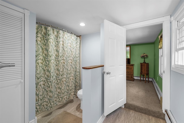 2410 Bruynswick Rd, Wallkill, NY 12589 - full bathroom with a baseboard heating unit, toilet, wood finished floors, baseboards, and recessed lighting
