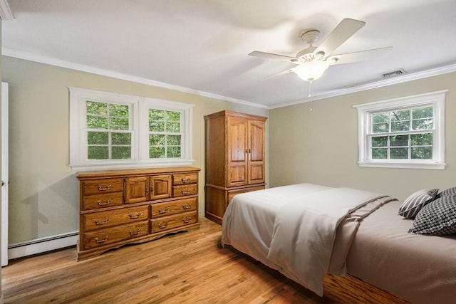 26 Crown Hill Rd, Wappingers Falls, NY 12590 - bedroom featuring a baseboard heating unit, ornamental molding, light wood-type flooring, and a ceiling fan