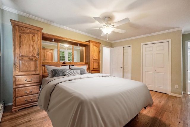 26 Crown Hill Rd, Wappingers Falls, NY 12590 - bedroom featuring multiple closets, light wood-style flooring, ornamental molding, baseboard heating, and a ceiling fan