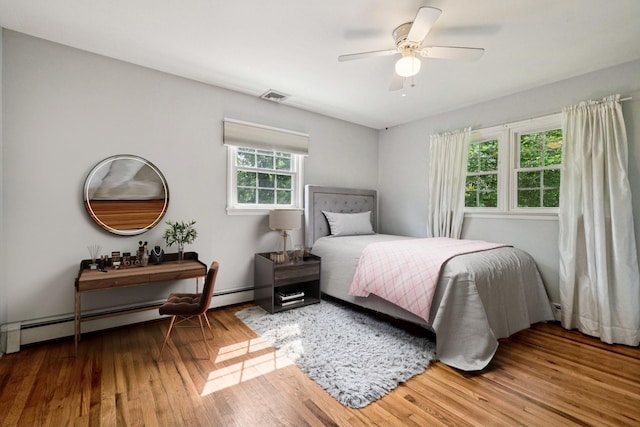 26 Crown Hill Rd, Wappingers Falls, NY 12590 - bedroom with wood finished floors, ceiling fan, and a baseboard radiator