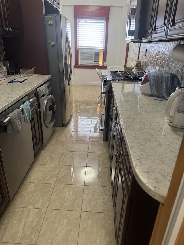 3591 161st St Unit 2J, Flushing, NY 11358 - kitchen with washer / clothes dryer, stainless steel appliances, light stone counters, cooling unit, and baseboards