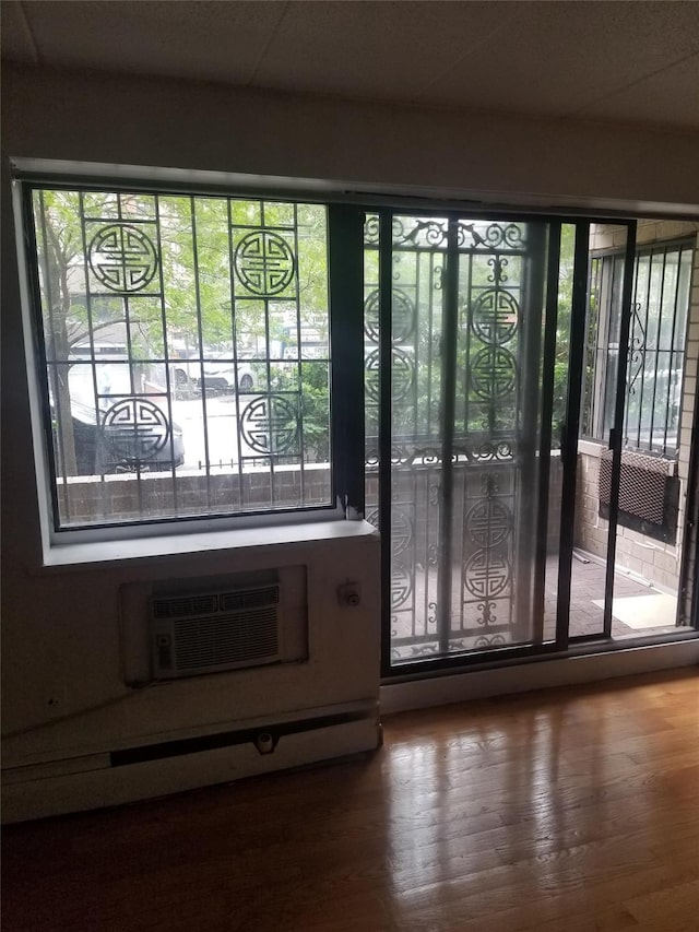 134-46 Maple Ave Unit 1C, Flushing, NY 11355 - entryway featuring wood finished floors and a wall mounted AC