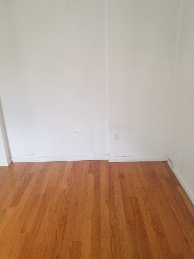 134-46 Maple Ave Unit 1C, Flushing, NY 11355 - empty room featuring light wood finished floors and baseboards