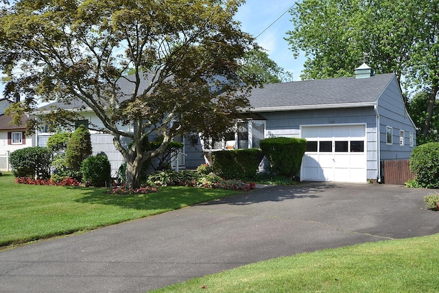 1318 Brooklyn Blvd, Bay Shore, NY 11706 - view of front of property featuring a garage, asphalt driveway, a shingled roof, and a chimney