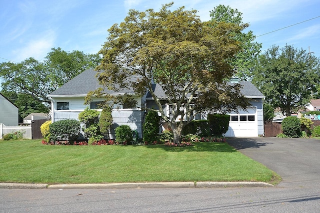 1318 Brooklyn Blvd, Bay Shore, NY 11706 - obstructed view of property with driveway, roof with shingles, and an attached garage