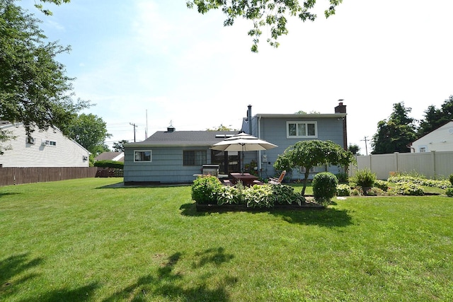 1318 Brooklyn Blvd, Bay Shore, NY 11706 - rear view of house featuring a chimney