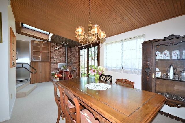 1318 Brooklyn Blvd, Bay Shore, NY 11706 - dining area featuring a wood stove, wooden ceiling, a chandelier, carpet floors, and lofted ceiling