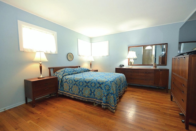 1318 Brooklyn Blvd, Bay Shore, NY 11706 - bedroom featuring wood finished floors and multiple windows