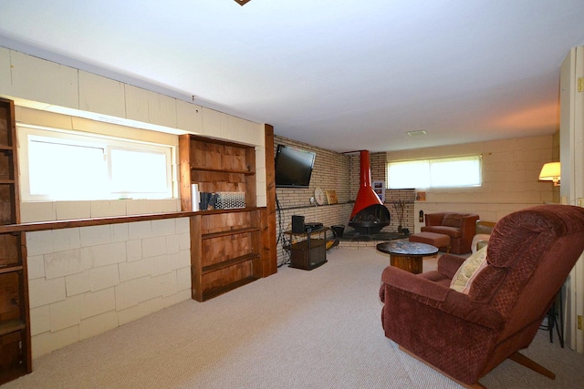 1318 Brooklyn Blvd, Bay Shore, NY 11706 - living area featuring a wood stove and carpet flooring