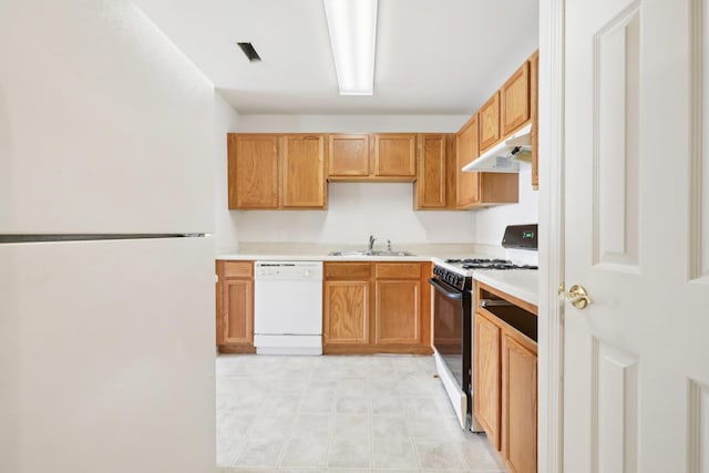 1080 Maggie Rd Unit 12-9, Newburgh, NY 12550 - kitchen featuring white appliances, under cabinet range hood, light countertops, and a sink