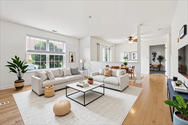 1080 Maggie Rd Unit 12-9, Newburgh, NY 12550 - living room featuring light wood finished floors, a ceiling fan, and baseboards