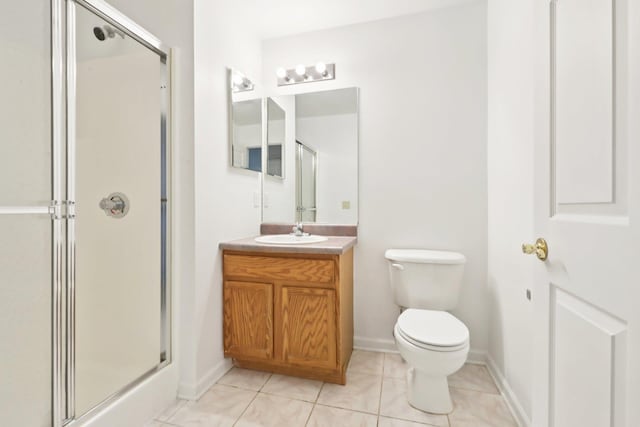 1080 Maggie Rd Unit 12-9, Newburgh, NY 12550 - full bath featuring a stall shower, vanity, toilet, tile patterned floors, and baseboards