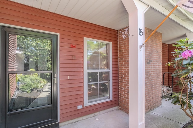 15 Candlestick Ct, Warwick, NY 10990 - doorway to property with a porch and brick siding