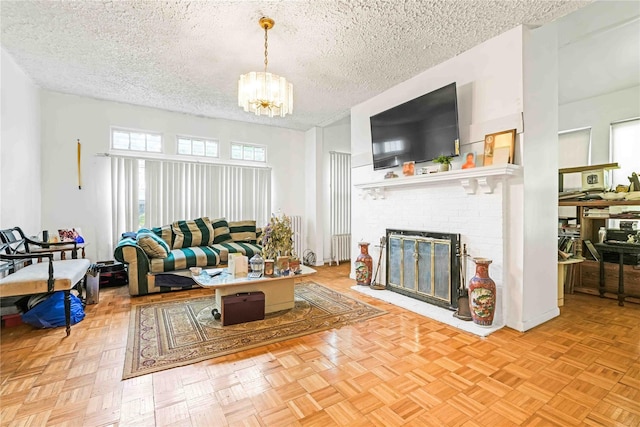 11480 178th Pl, Addisleigh Park, NY 11434 - living area with a textured ceiling, radiator heating unit, a chandelier, and a fireplace