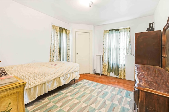 11480 178th Pl, Addisleigh Park, NY 11434 - bedroom featuring radiator heating unit and light wood-style floors