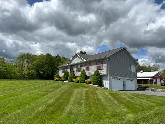 6452 State Route 52, Lake Huntington, NY 12752 - view of front of home with an attached garage, a front yard, and asphalt driveway