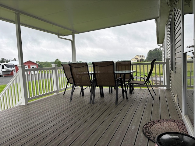 6452 State Route 52, Lake Huntington, NY 12752 - wooden deck featuring outdoor dining space and a lawn