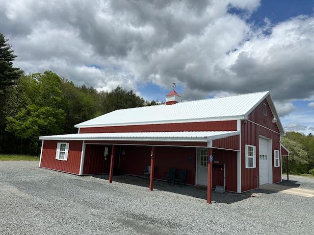 6452 State Route 52, Lake Huntington, NY 12752 - view of side of home featuring an outbuilding and a garage