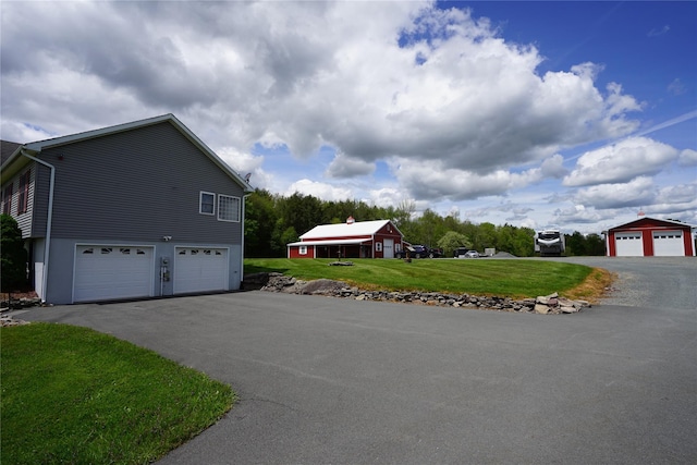 6452 State Route 52, Lake Huntington, NY 12752 - view of side of home with driveway, a yard, and a garage