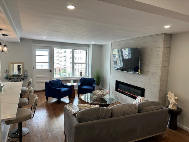 855 E Broadway Unit 3D, Long Beach, NY 11561 - living room with a large fireplace, dark wood-style flooring, and recessed lighting