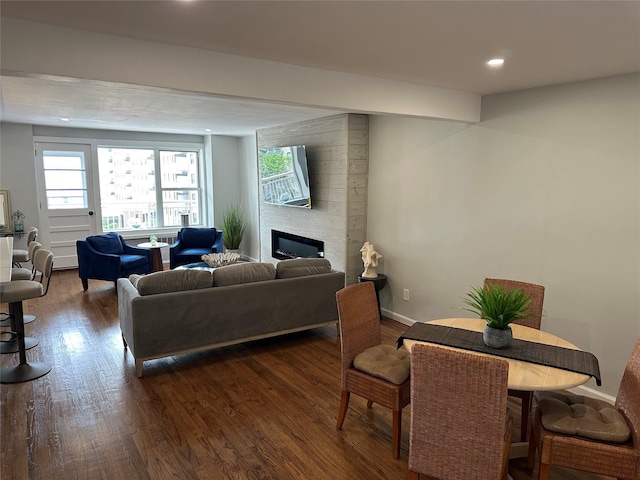 855 E Broadway Unit 3D, Long Beach, NY 11561 - living area with dark wood-style flooring, healthy amount of natural light, recessed lighting, a fireplace, and baseboards