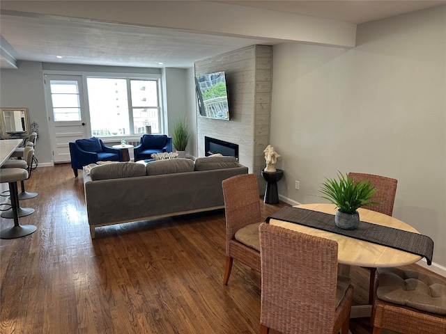 855 E Broadway Unit 3D, Long Beach, NY 11561 - living room with dark wood-type flooring, a fireplace, and baseboards