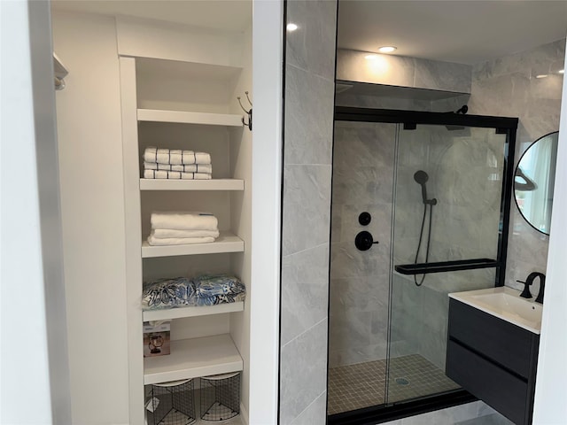 855 E Broadway Unit 3D, Long Beach, NY 11561 - full bath with a shower stall, vanity, and built in shelves