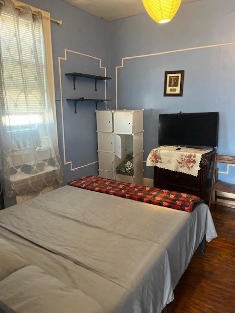 5436 Nurge Ave, Maspeth, NY 11378 - bedroom with wood finished floors and baseboards