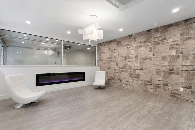 1769 E 13th St Unit 2B, Brooklyn, NY 11229 - unfurnished living room with a glass covered fireplace, tile patterned floors, and recessed lighting