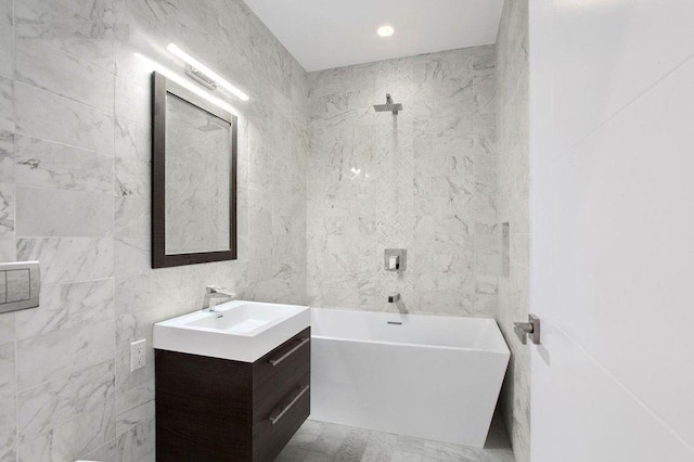 1769 E 13th St Unit 2B, Brooklyn, NY 11229 - full bathroom featuring a freestanding bath, vanity, and tile walls