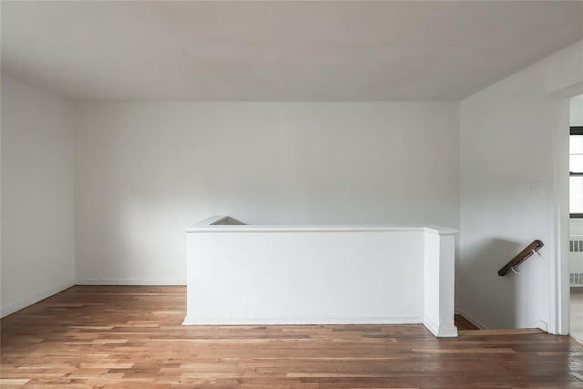 67-09 136th St Unit B, Kew Garden Hills, NY 11367 - empty room featuring wood finished floors and radiator heating unit