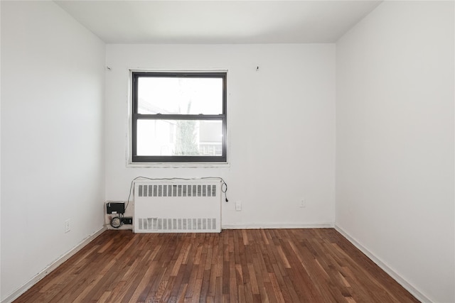 67-09 136th St Unit B, Kew Garden Hills, NY 11367 - unfurnished room with radiator heating unit and wood finished floors