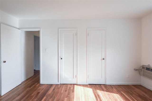 67-09 136th St Unit B, Kew Garden Hills, NY 11367 - unfurnished bedroom featuring wood finished floors