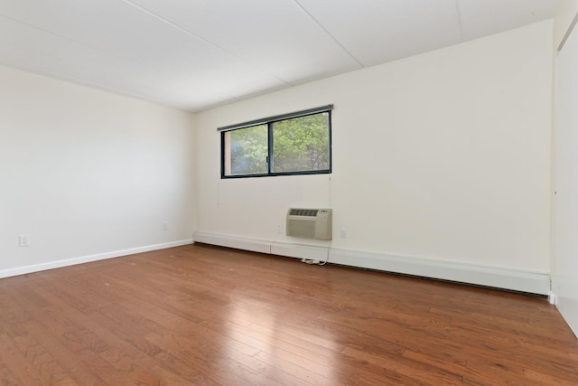 1155 Warburton Ave Unit 4G, Yonkers, NY 10701 - empty room with wood finished floors, a wall mounted air conditioner, and baseboard heating