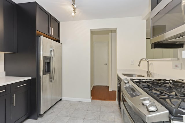 1155 Warburton Ave Unit 4G, Yonkers, NY 10701 - kitchen with stainless steel appliances, light marble finish flooring, light countertops, and dark cabinetry
