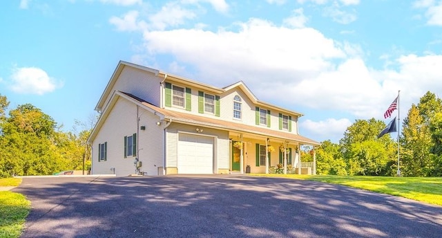 2 Joseph St, West Haverstraw, NY 10993 - view of front of house with covered porch, driveway, and an attached garage